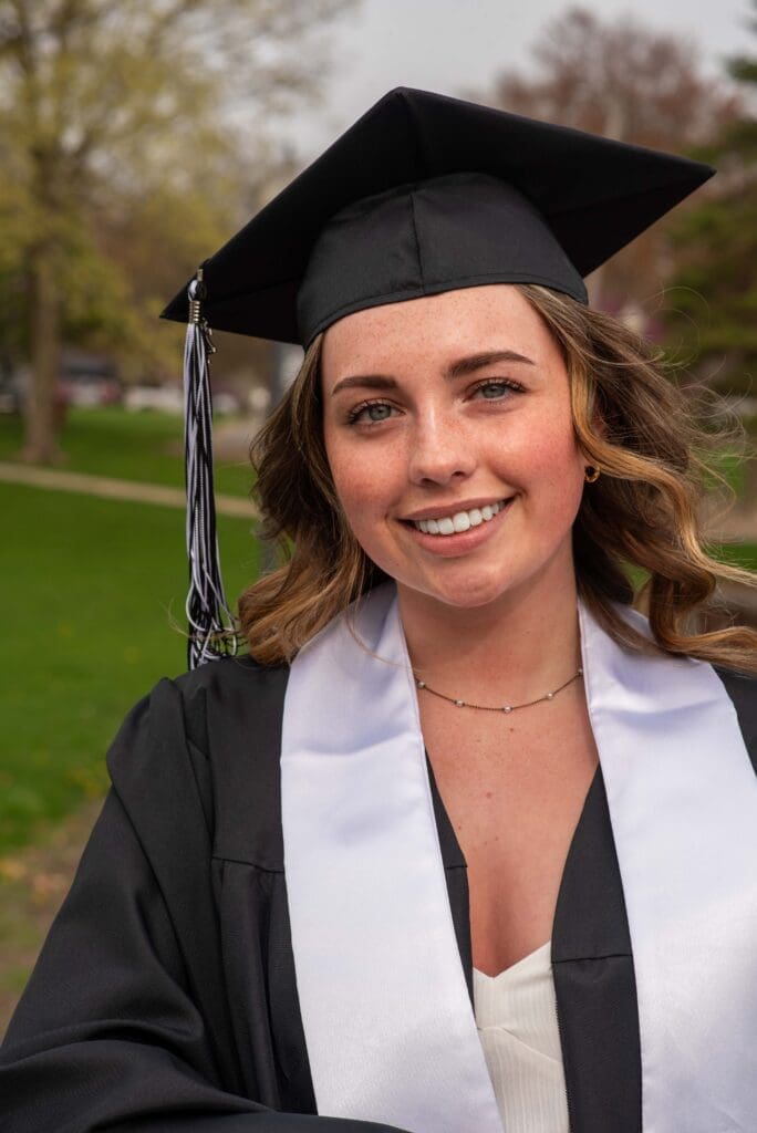 high school girl graduate with sash